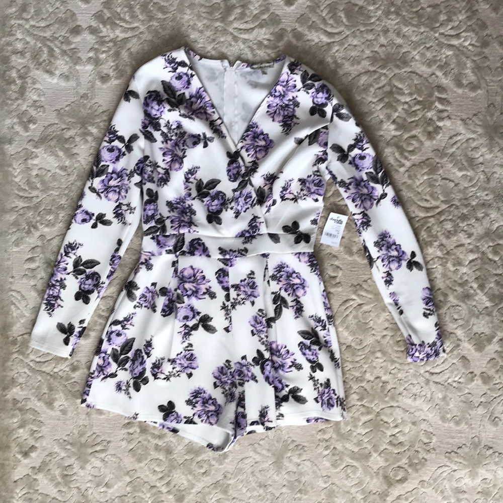 Floral romper brand new size medium